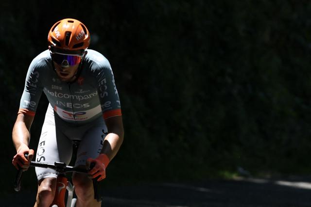 Netcompany Ineos Cycling Team's French rider Kévin Vauquelin cycles during the 7th stage of the Tour Auvergne-Rhone-Alpes cycling race (formerly known as the Criterium du Dauphine), 133,6km between La Bridoire and Grand Colombier in the French Alps on June 13, 2026. (Photo by Anne-Christine POUJOULAT / AFP)