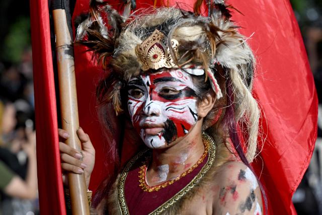 Balinese people take part in a parade during the Bali Art Festival in Denpasar, Indonesia resort island of Bali island on June 13, 2026. (Photo by SONNY TUMBELAKA / AFP)