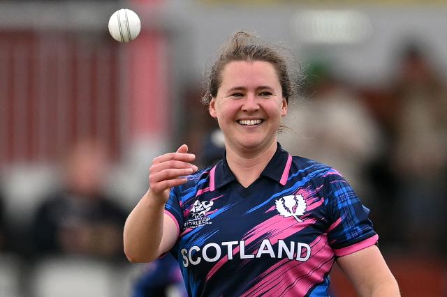 Scotland's captain Kathryn Bryce celebrates catching the ball to take the wicket of Ireland's Alana Dalzell on the second day of the ICC Women's T20 cricket World Cup 2026 Group 2 stage cricket match between Scotland and Ireland at the Old Trafford Cricket Ground in Manchester, northern England, on June 13, 2026. (Photo by Oli SCARFF / AFP)