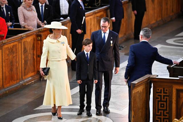 Crown Princess Victoria of Sweden, Prince Oscar and Crown Prince Daniel of Sweden arrive to attend the Te Deum thanksgiving service marking the golden wedding anniversary of the King and Queen of Sweden at the Royal Chapel in Stockholm, Sweden, on June 13, 2026. (Photo by Christine OLSSON / TT News Agency / AFP) / Sweden OUT
