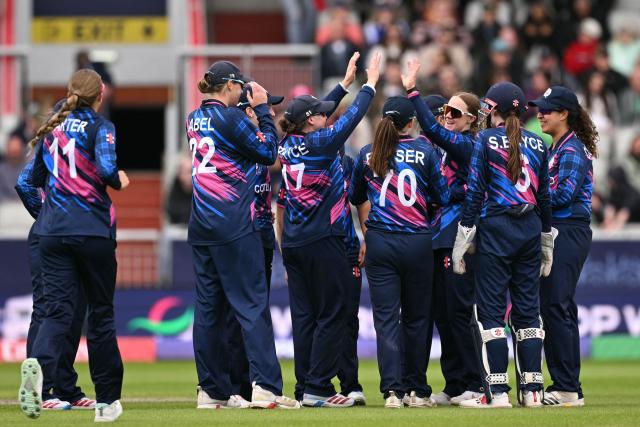 Scotland celebrate taking the wicket of Ireland's Rebecca Stokell (not pictured) on the second day of the ICC Women's T20 cricket World Cup 2026 Group 2 stage cricket match between Scotland and Ireland at the Old Trafford Cricket Ground in Manchester, northern England, on June 13, 2026. (Photo by Oli SCARFF / AFP)