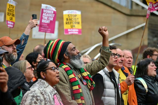 People take part in an anti-racism demonstration in central Glasgow, Scotland on June 13, 2026. (Photo by ANDY BUCHANAN / AFP)