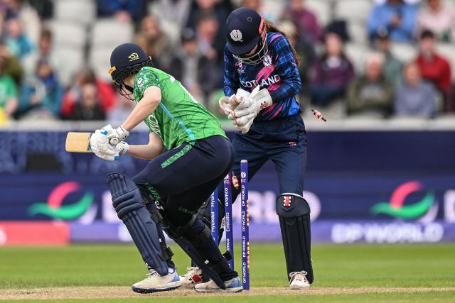 Ireland's Rebecca Stokell (L) is dismissed on the second day of the ICC Women's T20 cricket World Cup 2026 Group 2 stage cricket match between Scotland and Ireland at the Old Trafford Cricket Ground in Manchester, northern England, on June 13, 2026. (Photo by Oli SCARFF / AFP)