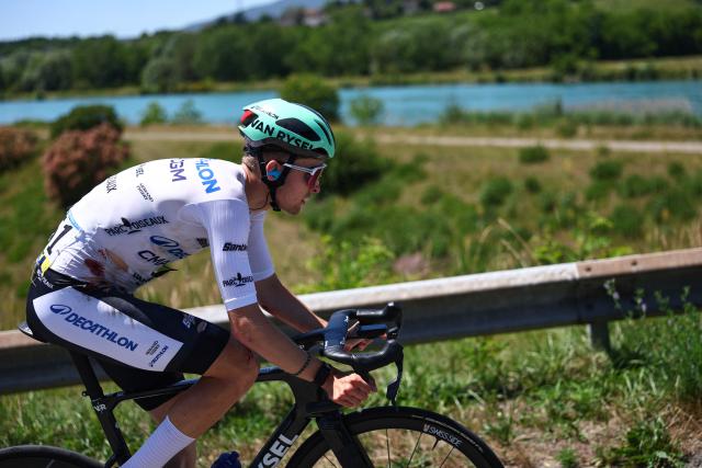 Decathlon CMA CGM Team's French rider Paul Seixas wearing the best young rider's white jersey cycles, bearing visible injuries following a crash, during the 7th stage of the Tour Auvergne-Rhone-Alpes cycling race (formerly known as the Criterium du Dauphine), 133,6km between La Bridoire and Grand Colombier in the French Alps on June 13, 2026. (Photo by Anne-Christine POUJOULAT / AFP)