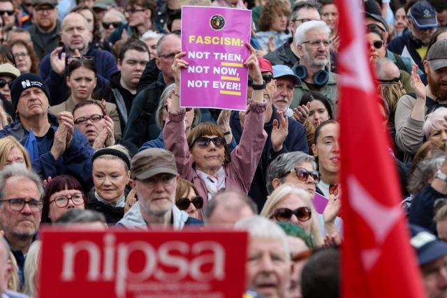 People turn out for a demonstration against racism and call for calm in central Belfast, Northern Ireland on June 13, 2026, after a few nights of disorder hit the city when video of a knife attack on June 8 went viral across social media platforms. Thousands of people on June 13 gathered for an anti-racism rally in the Northern Irish city of Belfast after unrest sparked by a horrific stabbing. (Photo by Paul Faith / AFP)