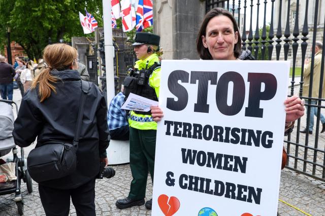 People turn out for a demonstration against racism and call for calm in central Belfast, Northern Ireland on June 13, 2026, after a few nights of disorder hit the city when video of a knife attack on June 8 went viral across social media platforms. Thousands of people on June 13 gathered for an anti-racism rally in the Northern Irish city of Belfast after unrest sparked by a horrific stabbing. (Photo by Paul Faith / AFP)