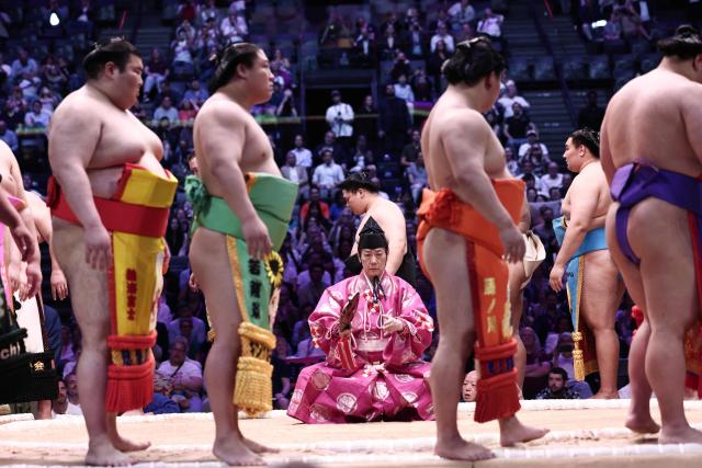 Sumo wrestlers take part in the opening ceremony ahead of the day 1 of the 2026 MUFG Paris Sumo Tournament, in Paris on June 13, 2026. (Photo by Behrouz MEHRI / AFP)