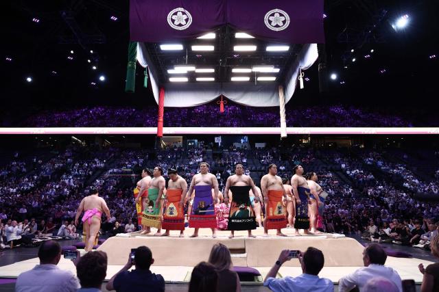 Sumo wrestlers take part in the opening ceremony ahead of the day 1 of the 2026 MUFG Paris Sumo Tournament, in Paris on June 13, 2026. (Photo by Behrouz MEHRI / AFP)