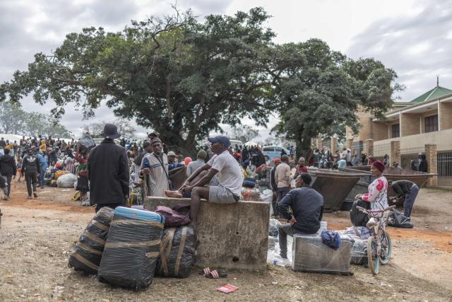 Displaced migrants gather at Sherwood Park in Durban on June 13, 2026 after fleeing their homes amid fears of xenophobic attacks. Hundreds of migrants await repatriation to Malawi from South Africa following xenophobic violence in the country. (Photo by RAJESH JANTILAL / AFP)