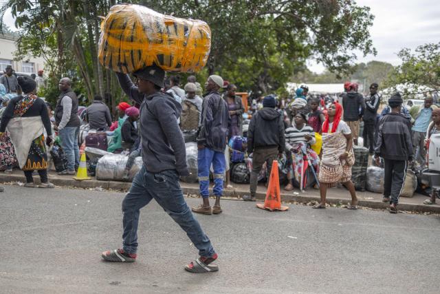 Displaced migrants gather at Sherwood Park in Durban on June 13, 2026 after fleeing their homes amid fears of xenophobic attacks. Hundreds of migrants await repatriation to Malawi from South Africa following xenophobic violence in the country. (Photo by RAJESH JANTILAL / AFP)