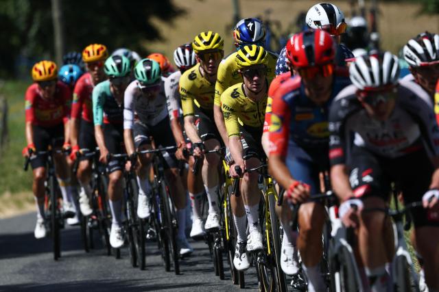 The pack of riders (peloton) cycles during the 7th stage of the Tour Auvergne-Rhone-Alpes cycling race (formerly known as the Criterium du Dauphine), 133,6km between La Bridoire and Grand Colombier in the French Alps on June 13, 2026. (Photo by Anne-Christine POUJOULAT / AFP)