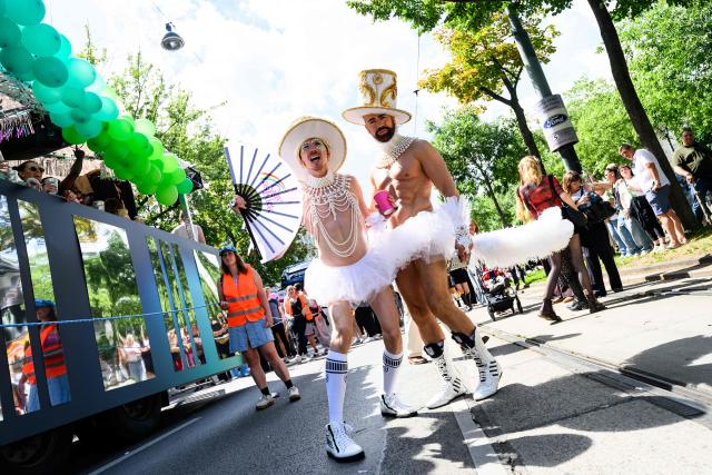 Dressed up participants pose during the 30th edition of the Vienna Pride Parade or Rainbow Parade in Vienna on June 13, 2026. The parade is an important political demonstration advocating for the rights of lesbian, gay, bisexual, transgender, intersex and queer people, according to organisers. (Photo by MAX SLOVENCIK / APA / AFP) / Austria OUT