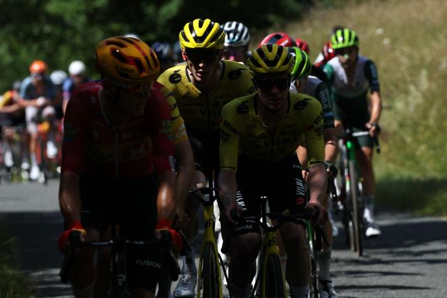 Team Visma | Lease a Bike's US rider Matteo Jorgenson (C) cycles with the pack of riders  during the 7th stage of the Tour Auvergne-Rhone-Alpes cycling race (formerly known as the Criterium du Dauphine), 133,6km between La Bridoire and Grand Colombier in the French Alps on June 13, 2026. (Photo by Anne-Christine POUJOULAT / AFP)