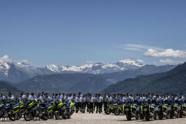 Members of the French gendarmerie motorcycling unit stand next to motocycles as they attend a general briefing for G7 security operations prior to the summit, in La Roche-sur-Foron, eastern France, on June 12, 2026. (Photo by Jeff PACHOUD / AFP)