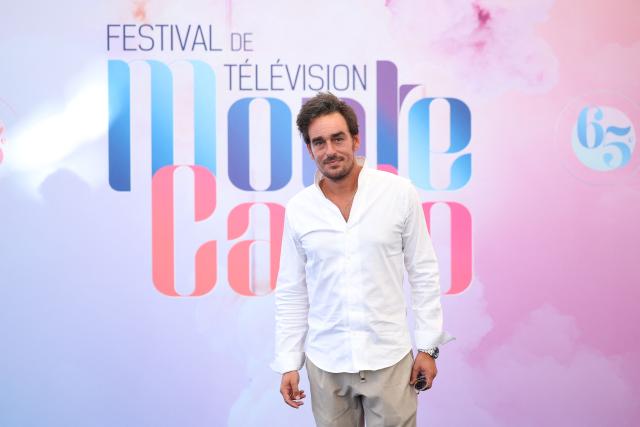 French comedian Kevin Levy poses during a photocall for the TV series "Demain nous appartient" during the 65th Monte-Carlo Television Festival in Monaco on June 13, 2026. (Photo by Valery HACHE / AFP)
