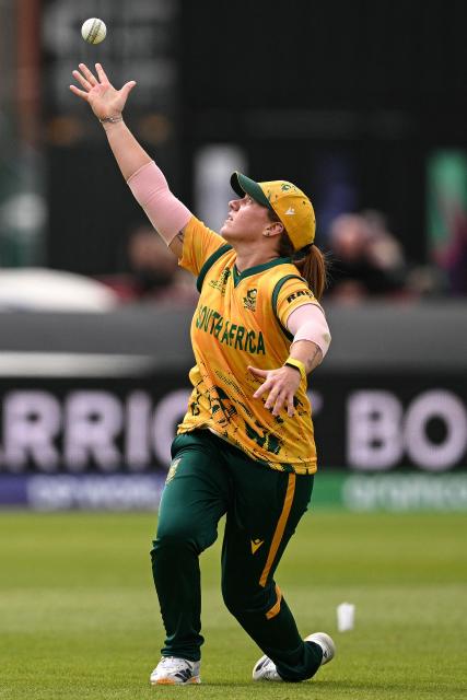 South Africa's Nadine de Klerk celebrates by tossing the ball up after making a catch against Australia's Annabel Sutherland (not pictured) during the ICC Women's T20 cricket world cup 2026 game between Australia and South Africa, at Old Trafford in Manchester, north-west England on June 13, 2026. (Photo by Oli SCARFF / AFP)