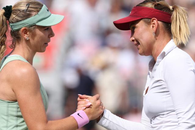 Croatia's Donna Vekic shakes hands with Britain's Katie Boulter (L) during their women's singles semi-final tennis match at the HSBC WTA Championships at Queen's Club in west London on June 13, 2026. (Photo by Adrian Dennis / AFP)