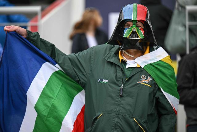 A South Africa supporter poses as he cheers on the team during the ICC Women's T20 cricket world cup 2026 game between Australia and South Africa, at Old Trafford in Manchester, north-west England on June 13, 2026. (Photo by Oli SCARFF / AFP)