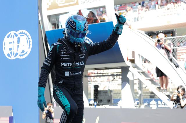Mercedes' British driver George Russell celebrates pole position after the qualifying session at the Circuit de Catalunya ahead of the Catalonia Formula One Grand Prix in Montmelo, on the outskirts of Barcelona, on June 13, 2026. (Photo by Lluis GENE / AFP)