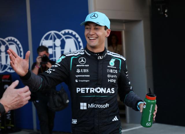Mercedes' British driver George Russell celebrates pole position after the qualifying session at the Circuit de Catalunya ahead of the Catalonia Formula One Grand Prix in Montmelo, on the outskirts of Barcelona, on June 13, 2026. (Photo by Lluis GENE / AFP)