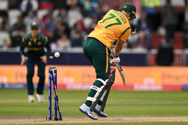 South Africa's Annerie Dercksen (R) is bowled out by Australia's Kim Garth (not pictured) during the ICC Women's T20 cricket world cup 2026 game between Australia and South Africa, at Old Trafford in Manchester, north-west England on June 13, 2026. (Photo by Oli SCARFF / AFP)