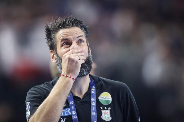SC Magdeburg's German headcoach Bennet Wiegert reacts during the EHF Men's Handball Champions League Final 4 semi-final match between SC Magdeburg and Fuechse Berlin in Cologne, western Germany on June 13, 2026. (Photo by Ronny HARTMANN / AFP)