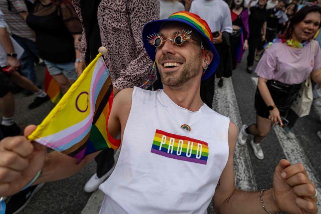 Participants of the Warsaw Pride parade with rainbow-colored flags celebrate in the streets of Warsaw, Poland, on June 13, 2026 (Photo by Wojtek RADWANSKI / AFP)