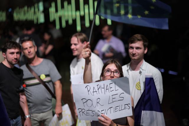 People gather at the start of a political meeting of French centre-left party Place publique ahead of the April 2027 French presidential election in Aubervilliers, a northern suburb of Paris, on June 13, 2026. (Photo by Kenzo TRIBOUILLARD / AFP)