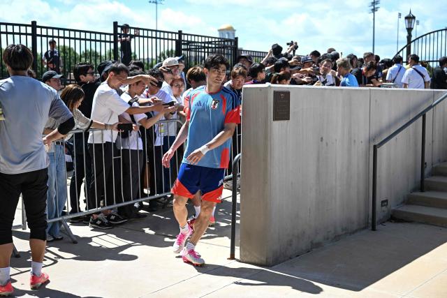 Japan's defender #03 Shogo Taniguchi arrives for an MD-1 training session on the eve of the 2026 World Cup Group F football match between the Netherlands and Japan, at the Dallas Stadium in Arlington on June 13, 2026. (Photo by Paul ELLIS / AFP)