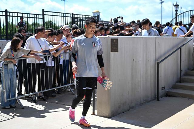 Japan's goalkeeper #23 Tomoki Hayakawa arrives for an MD-1 training session on the eve of the 2026 World Cup Group F football match between the Netherlands and Japan, at the Dallas Stadium in Arlington on June 13, 2026. (Photo by Paul ELLIS / AFP)