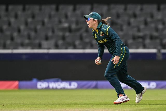 Australia's Georgia Wareham celebrates after taking the catch to dismiss South Africa's captain Laura Wolvaardt (not pictured) during the ICC Women's T20 cricket world cup 2026 game between Australia and South Africa, at Old Trafford in Manchester, north-west England on June 13, 2026. (Photo by Oli SCARFF / AFP)