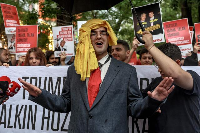 A demonstrator gestures during a rally against the upcoming NATO Summit early July in Ankara, on June 13, 2026. US Secretary of State confirmed the US President would attend the July 7-8 summit in the Turkish capital, as concerns linger about Washington's commitment to the transatlantic alliance. (Photo by Adem ALTAN / AFP)