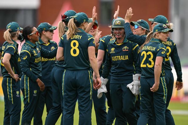 Australia celebrate after the dismissal of South Africa's Sinalo Jafta (not pictured) during the ICC Women's T20 cricket world cup 2026 game between Australia and South Africa, at Old Trafford in Manchester, north-west England on June 13, 2026. (Photo by Oli SCARFF / AFP)