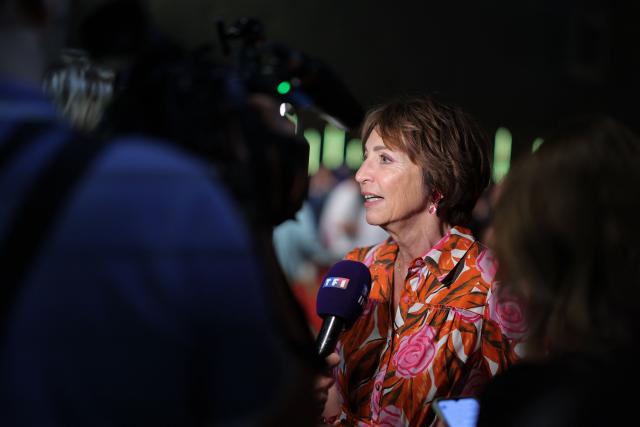 French former socialist health minister Marisol Touraine talks to journalist before the start of a political rally of French centre-left party Place publique ahead of the April 2027 French presidential election in Aubervilliers, a northern suburb of Paris, on June 13, 2026. (Photo by Kenzo TRIBOUILLARD / AFP)