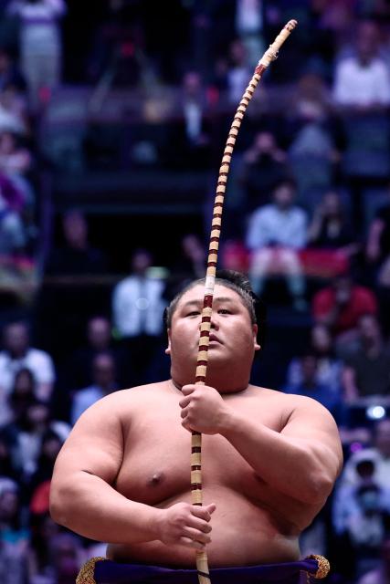 A sumo wrestler performs during the Bow-twirling ceremony (Yumitori-shiki) on day 1 of the 2026 MUFG Paris Sumo Tournament, in Paris on June 13, 2026. (Photo by Behrouz MEHRI / AFP)