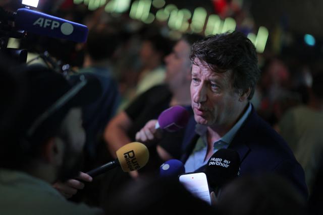 French green party Les Ecologists senator Yannick Jadot talks to journalist before the start of a political rally of French centre-left party Place publique ahead of the April 2027 French presidential election in Aubervilliers, a northern suburb of Paris, on June 13, 2026. (Photo by Kenzo TRIBOUILLARD / AFP)