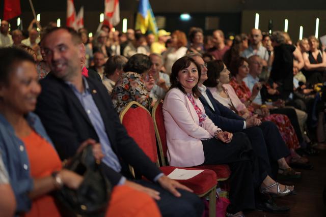 The president of the French administrativ region Occitanie and Socialist party member Carole Delga sits before the start of a political rally of French centre-left party Place publique ahead of the April 2027 French presidential election in Aubervilliers, a northern suburb of Paris, on June 13, 2026. (Photo by Kenzo TRIBOUILLARD / AFP)