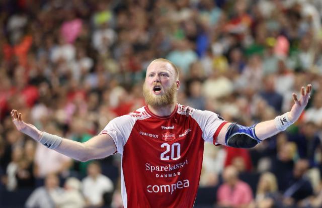 Aalborg's Swedish pivot #20 Felix Möller celebrates during the EHF Men's Handball Champions League Final 4 semi-final match between Aalborg Handbold and FC Barcelona in Cologne, western Germany on June 13, 2026. (Photo by Ronny HARTMANN / AFP)