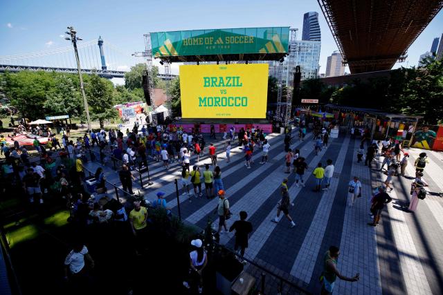 People gather ahead of a watch party for the 2026 World Cup football tournament match between Brazil and Morocco, at the FIFA Fan Zone in the Brooklyn borough of New York City, on June 13, 2026. (Photo by Leonardo MUNOZ / AFP)
