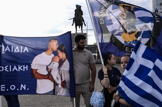 Protestors holding a Greek flag take part in the Family Pride, in Thessaloniki on June 13, 2026. One week before the Thessaloniki pride, members of orthodox and far-right parties parade "for the Greek family consisting of the man, the woman and the children", as they said. (Photo by Sakis Mitrolidis / AFP)