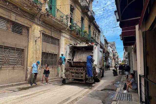 A garbage collection truck drives along a street of the Centro Havana neighborhood, in Havana, on June 13, 2026. (Photo by Pablo PORCIUNCULA / AFP)