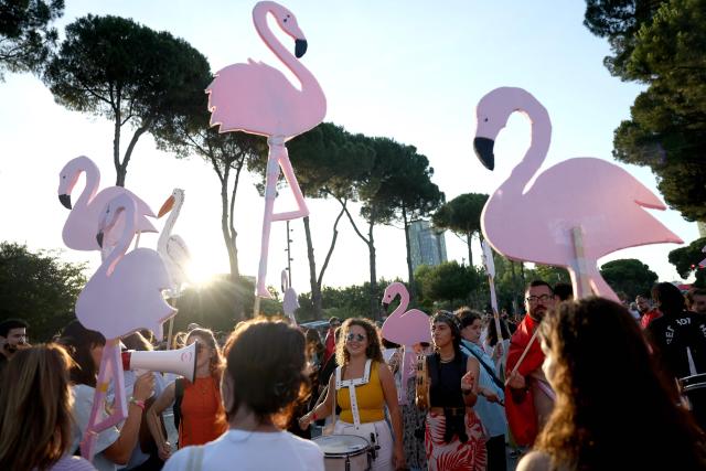 Protestors hold cartoon flamingos as they gather in front of Albania's Prime Minister's Office, in Tirana, on June 13, 2026 during a demonstration against the construction of a luxury resort near a protected natural area of Zvernec near Vlore. Several thousand citizens demonstrated in Tirana, 14 days in row after the first protest  repressed on Zvernec beach, to demand transparency around a tourist complex project allegedly linked to US President's son-in-law, Jared Kushner. The demonstrators argue that the estimated $1.2 billion project, led by Kushner and his wife Ivanka, will harm the environment, with plans for luxury hotels in the protected area of Vjosa-Narta on the southern coast. (Photo by Adnan Beci / AFP)