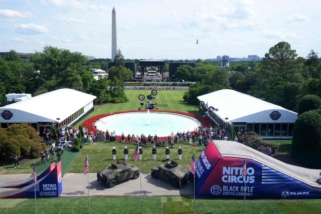A stunt performer does a motorcycle jump, ahead of Sunday's UFC Freedom 250 fights on the South Lawn of the White House in Washington, DC, on June 13, 2026. (Photo by Mark Schiefelbein / POOL / AFP)