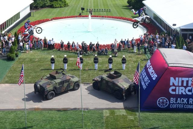 A stunt performer does a motorcycle jump, ahead of Sunday's UFC Freedom 250 fights on the South Lawn of the White House in Washington, DC, on June 13, 2026. (Photo by Mark Schiefelbein / POOL / AFP)