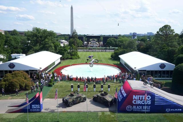 A stunt performer does a motorcycle jump, ahead of Sunday's UFC Freedom 250 fights on the South Lawn of the White House in Washington, DC, on June 13, 2026. (Photo by Mark Schiefelbein / POOL / AFP)