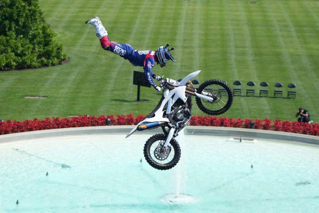 A stunt performer does a motorcycle jump, ahead of Sunday's UFC Freedom 250 fights on the South Lawn of the White House in Washington, DC, on June 13, 2026. (Photo by Mark Schiefelbein / POOL / AFP)