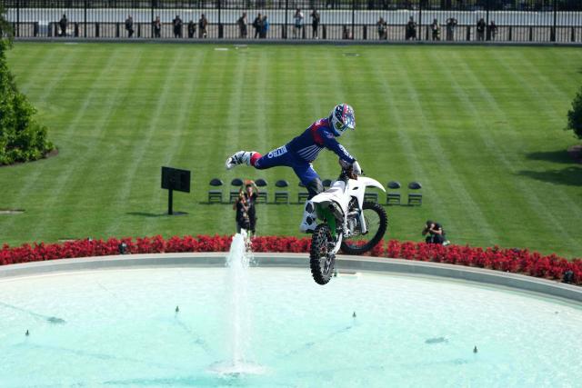 A stunt performer does a motorcycle jump, ahead of Sunday's UFC Freedom 250 fights on the South Lawn of the White House in Washington, DC, on June 13, 2026. (Photo by Mark Schiefelbein / POOL / AFP)