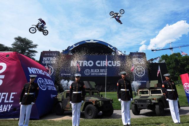 Stunt performers do a motorcycle jump, ahead of Sunday's UFC Freedom 250 fights on the South Lawn of the White House in Washington, DC, on June 13, 2026. (Photo by Alex Brandon / POOL / AFP)