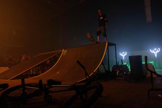 A young man performs skate tricks during "BRUDNY PES" (dirty dog), a multi-genre music festival independent music and street culture, at the Dovzhenko Film Studio in Kyiv on June 13, 2026, amid the Russian invasion of Ukraine. The festival will raffle off a car for donations in support of the Armed Forces of Ukraine. All funds raised will go toward purchasing drones. Since 2023, the festival has partnered with the "Khvostati" animal shelter, selecting a new dog each year to serve as the festivals mascot. Its photo is featured on the main poster, and seeks to find it a home. (Photo by Tetiana DZHAFAROVA / AFP)