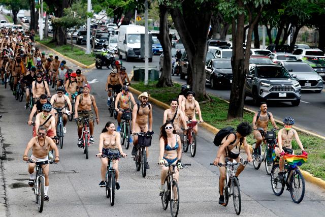 EDITORS NOTE: Graphic content / Cyclists participate in the 2026 World Naked Bike Ride in Guadalajara, Jalisco, Mexico, on June 13, 2026. (Photo by ULISES RUIZ / AFP)